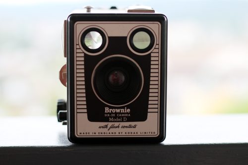 Vintage Kodak Brownie Six-20 box camera on a windowsill