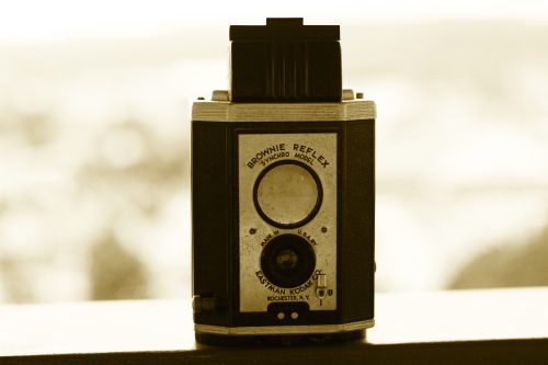 Vintage Kodak Brownie Reflex camera in sepia tone